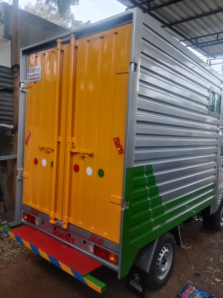 Rear view of container truck with orange doors